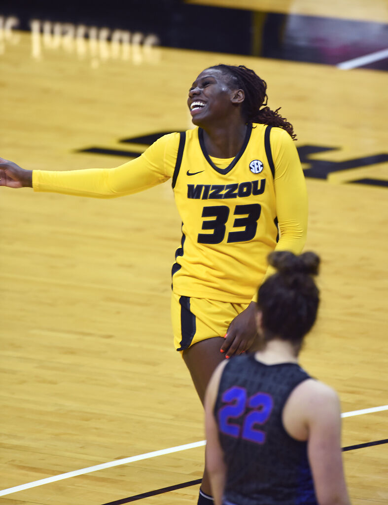 Aijha Blackwell laughs before putting up a free throw